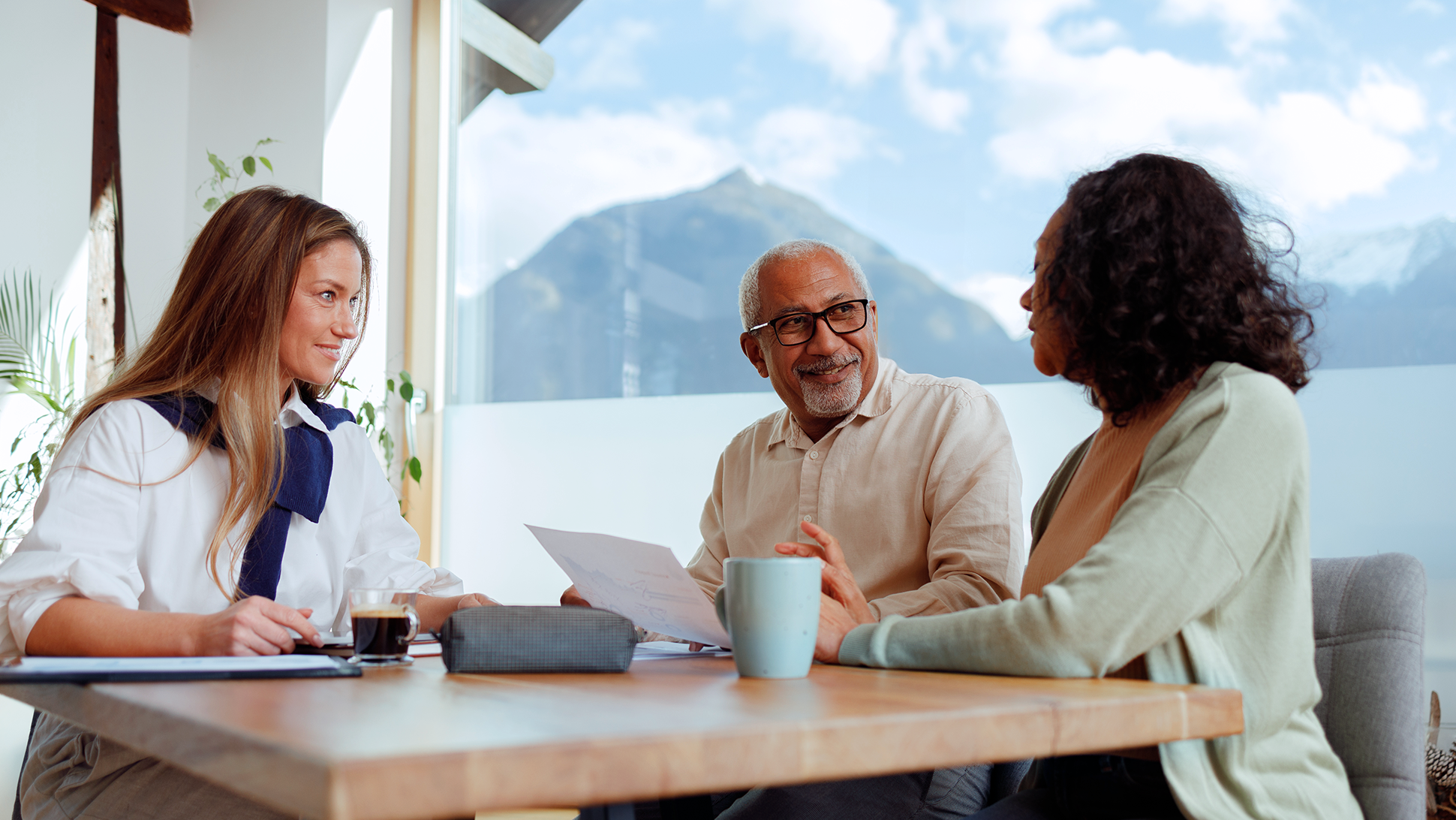 A couple discusses the different sources of investment income available in Canada with their financial advisor.
